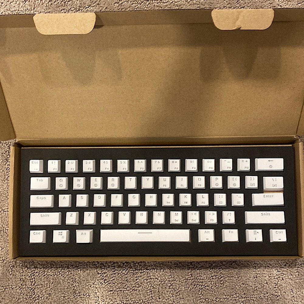 60% White Keycaps with a black keycap puller